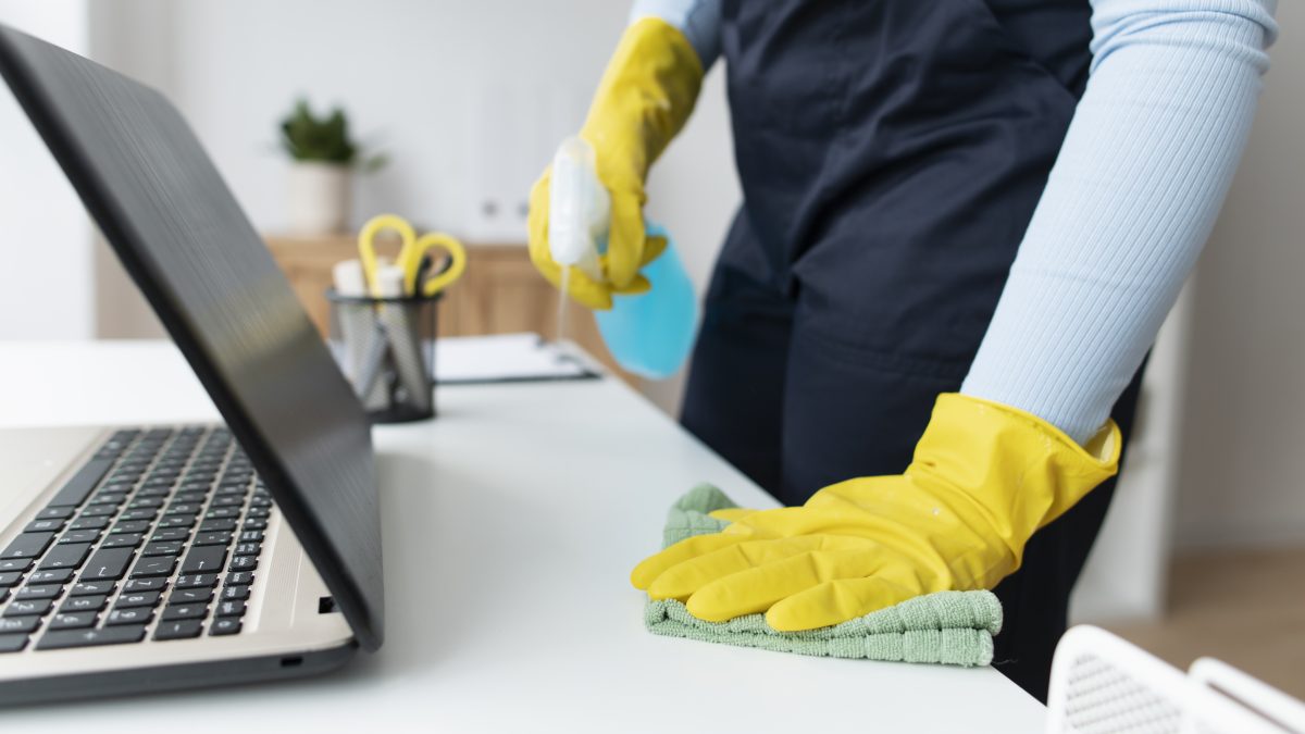 Cleaner sanitizing a desk
