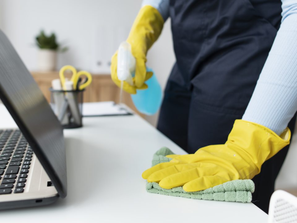 Cleaner sanitizing a desk